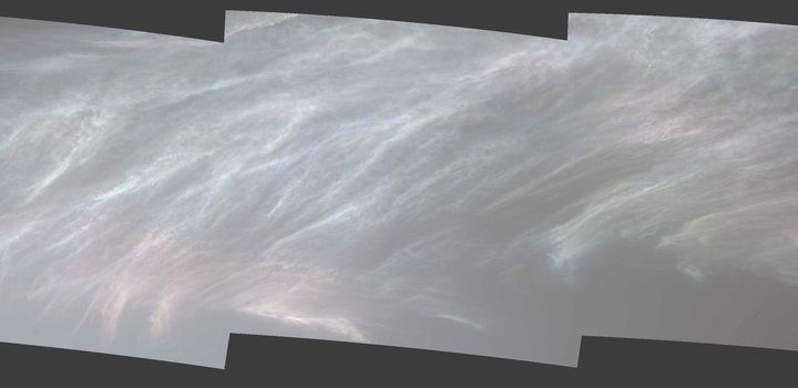 NASA’s Curiosity Mars rover spotted these iridescent, or “mother of pearl,” clouds on March 5, 2021, the 3,048th Martian day, or sol, of the mission. Seen here are five frames stitched together from a much wider panorama taken by the rover’s Mast Camera, or Mastcam.