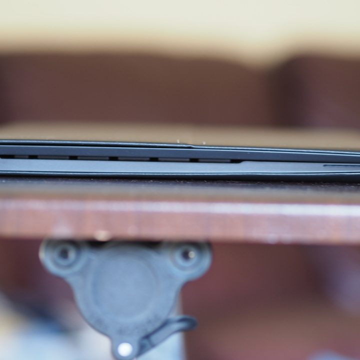 A side view of the HP Elite Folio sitting on a desk.