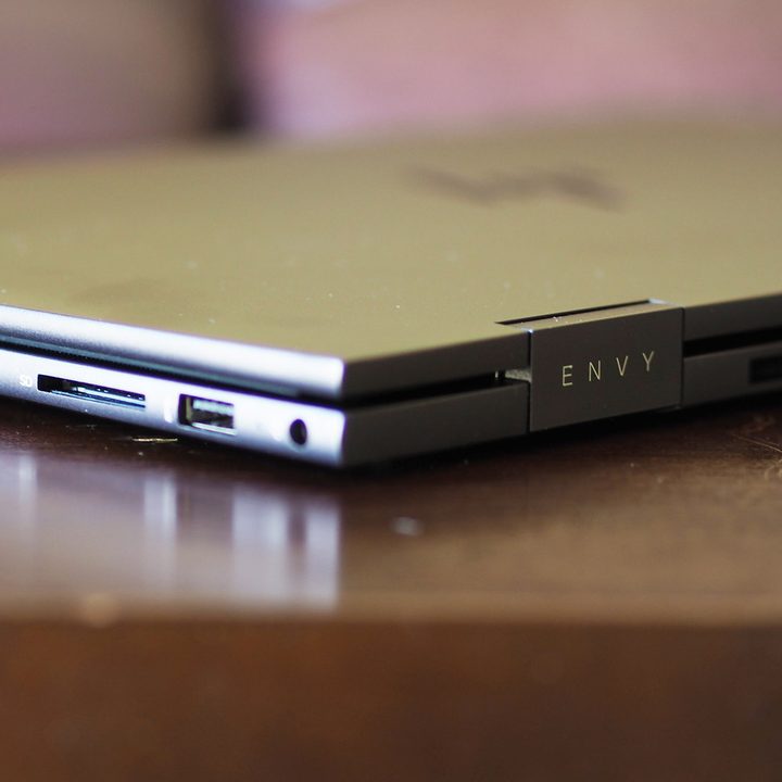 HP Envy x360 15 side view showing ports and back of chassis.