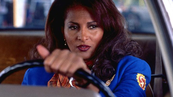 Pam Grier as Jackie Brown behind the wheel of a car in Jackie Brown.