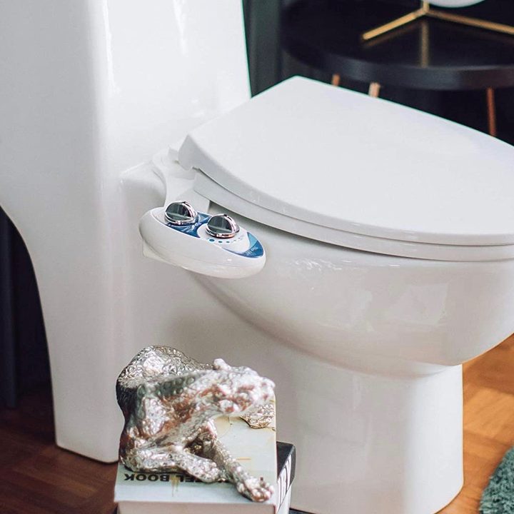 A bidet on a toilet seat.