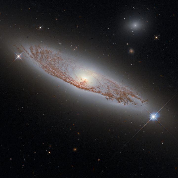 This image shows the spiral galaxy NGC 5037, in the constellation of Virgo. First documented by William Herschel in 1785, the galaxy lies about 150 million light-years away from Earth. Despite this distance, we can see the delicate structures of gas and dust within the galaxy in extraordinary detail. This detail is possible using Hubble&rsquo;s Wide Field Camera 3 (WFC3), whose combined exposures created this image. 