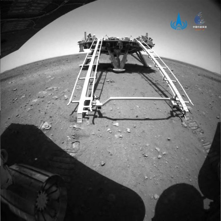 The view from the Zhurong rover as it deploys from its lander.