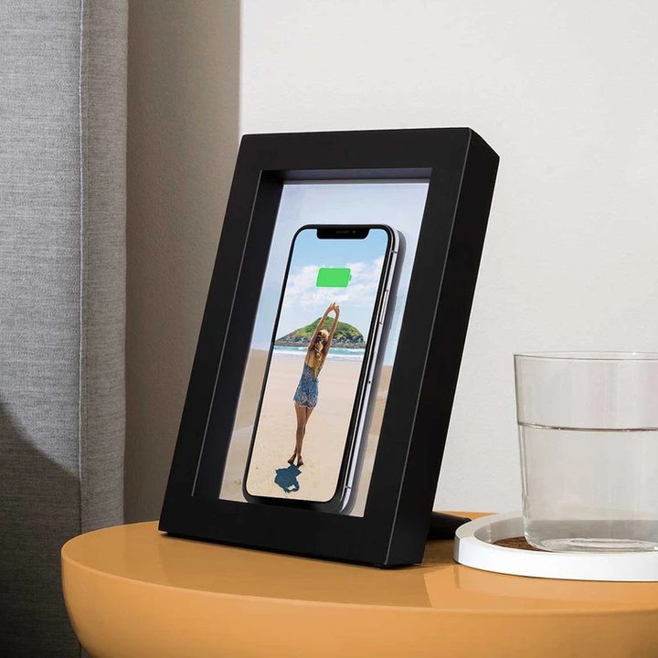 Smart phone wireless charger on top of night stand.