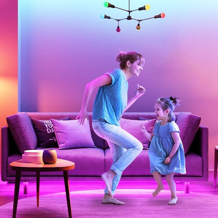 Mother and daughter dancing in living room with Govee smart lights on.