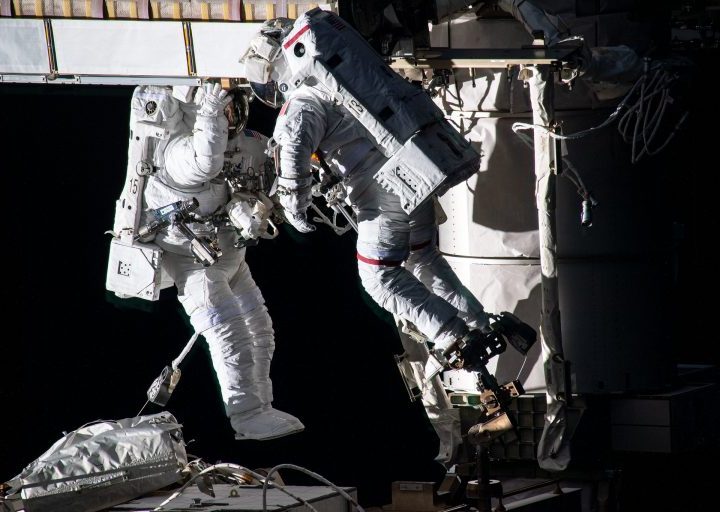 Spacewalkers (from left) Shane Kimbrough and Thomas Pesquet work to install new roll out solar arrays on the International Space Station’s P-6 truss structure on June 16, 2021.