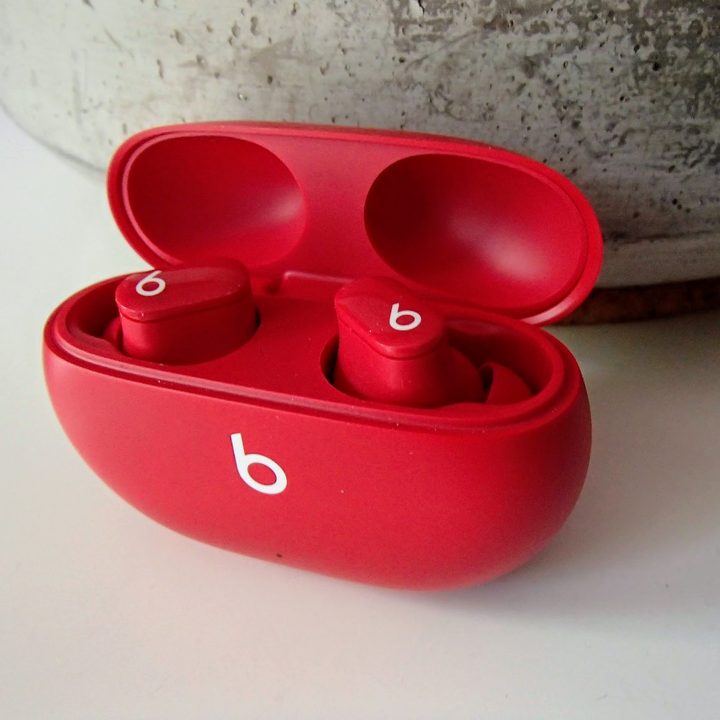 The Beats Studio Buds in their charging case.