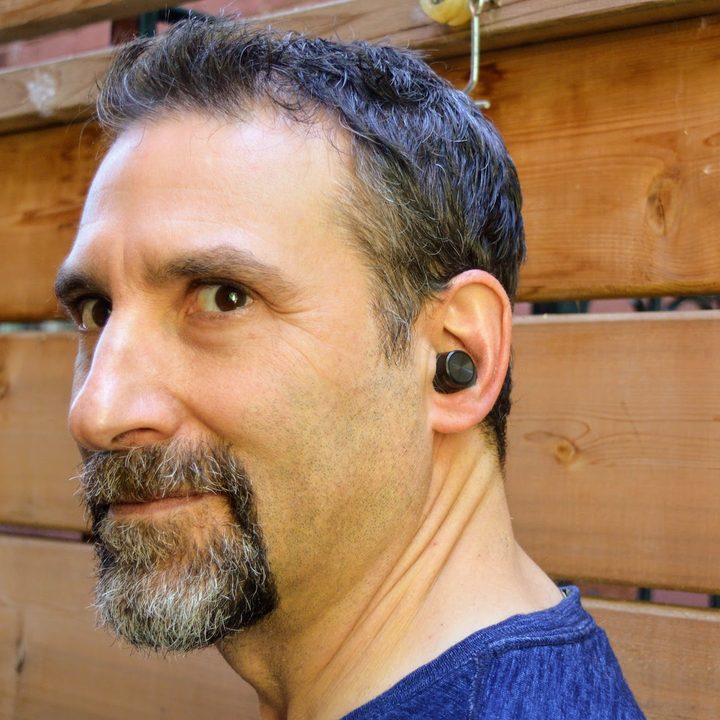 Bowers & Wilkins PI5 true wireless earbuds being worn.