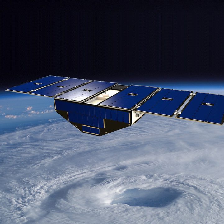 Illustration of one of the eight CYGNSS satellites in orbit above a hurricane.