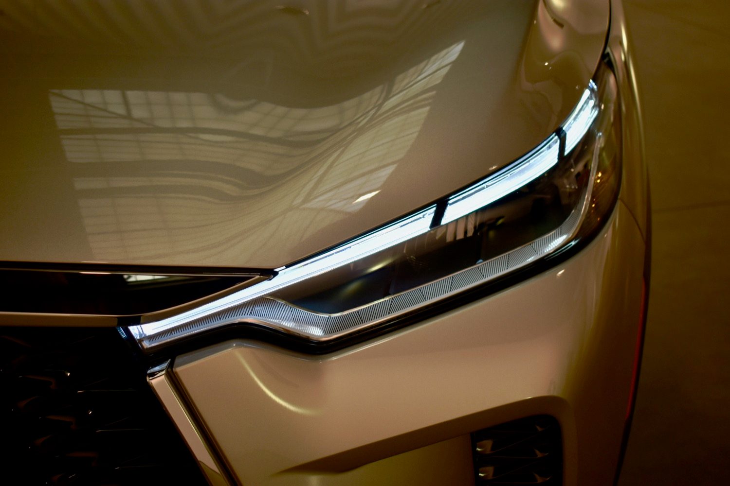 Detail view of 2022 Infiniti QX60 headlight.