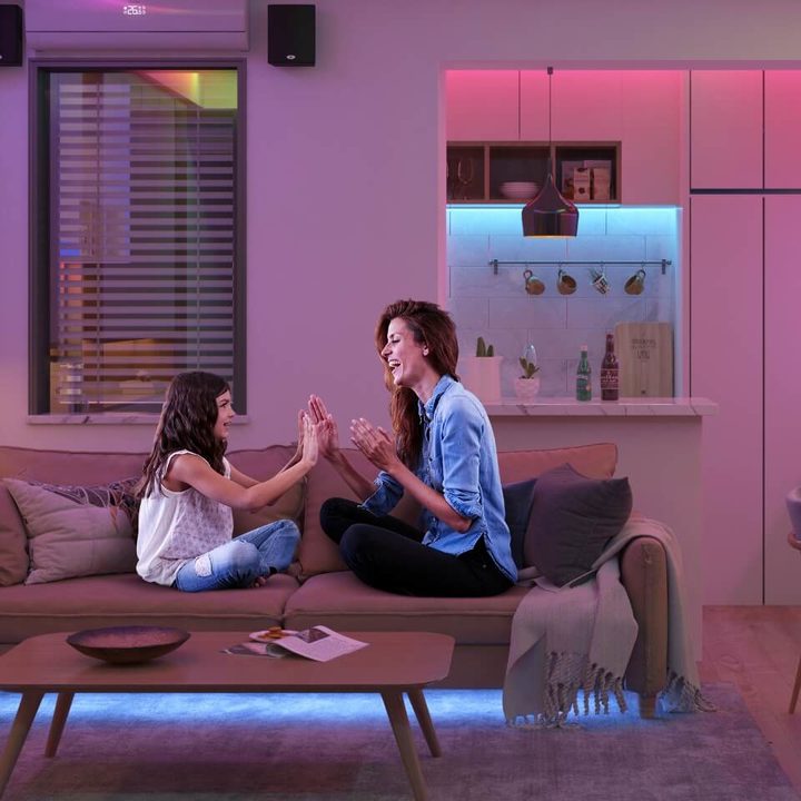 Mother and daughter in living room with Govee lights on.