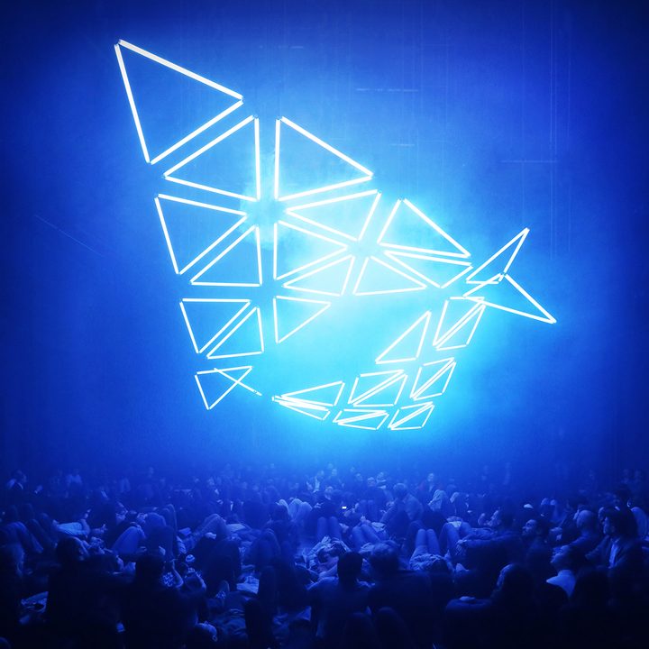 An overhead LED display at a concert.