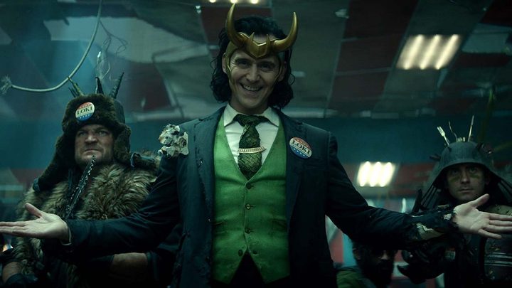 President Loki smiling and spreading his arms in Loki.