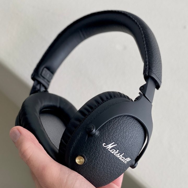 Marshall Monitor 2 headphones in hand.