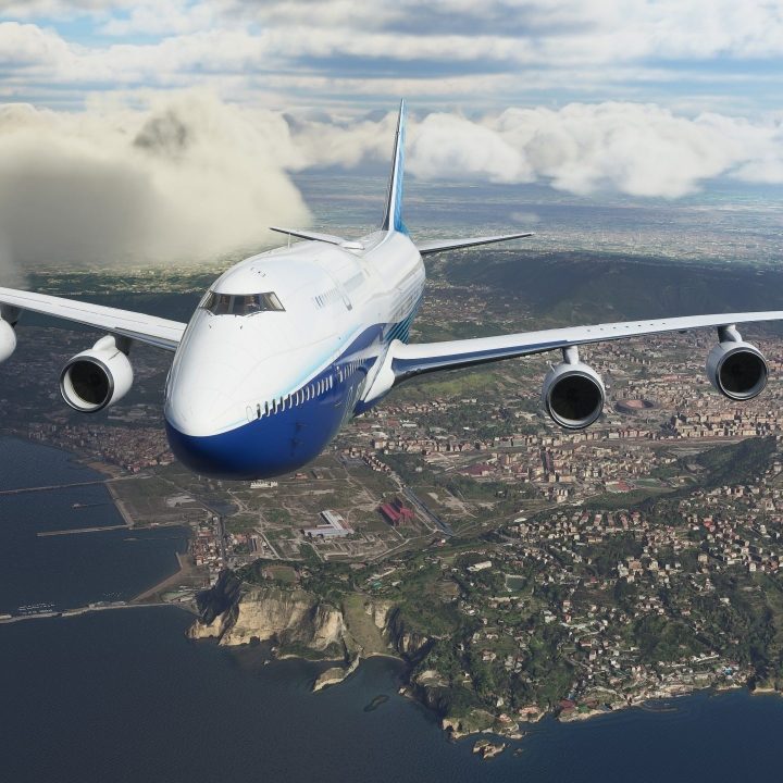 An airplane flies over a city in Microsoft Flight Simulator.