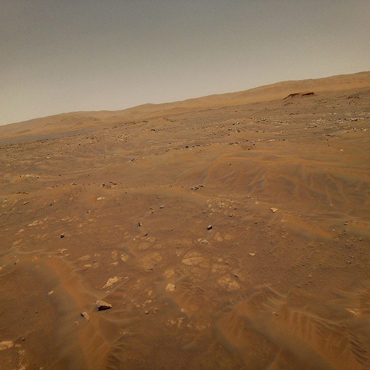 This image looking west toward the Séítah geologic unit on Mars was taken from the height of 33 feet (10 meters) by NASA’s Ingenuity Mars helicopter during its sixth flight, on May 22, 2021.