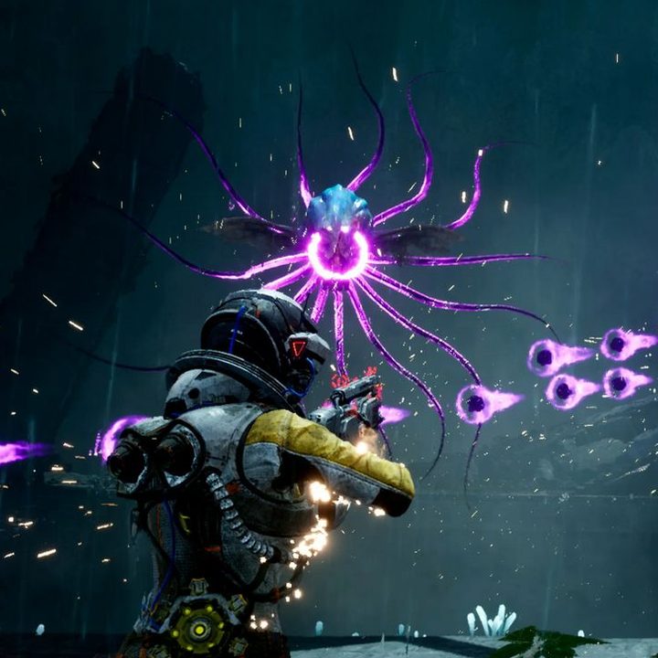 The protagonist from the game Returnal in a space suit posed in front of flag.