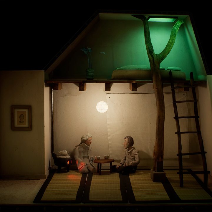 A scene from the game showing two characters in a dimly lit room.