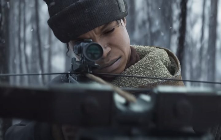 Character aims down the sights of a crossbow.