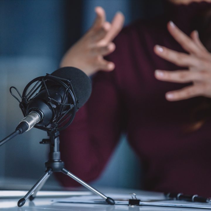 Someone using a microphone during a video chat.