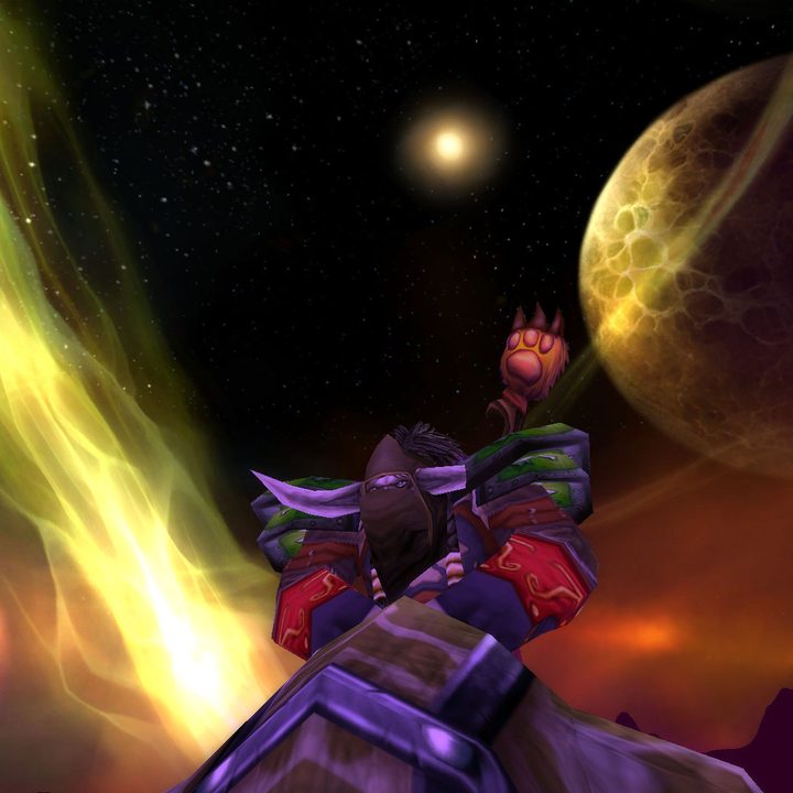 A tauren player character riding a mount against the Hellfire Penninsula backdrop in Burning Crusade Classic.