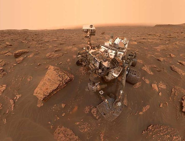 A self-portrait of NASA's Curiosity rover taken on Sol 2082. A Martian dust storm has reduced sunlight and visibility at the rover's location in Gale Crater.