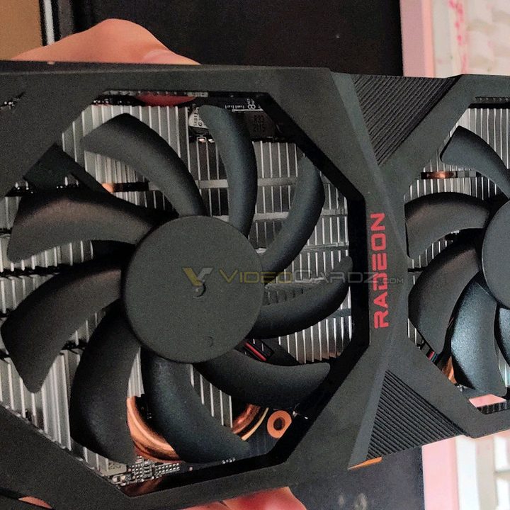 Someone holding a graphics card.