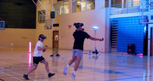 Arcadia.tv competitors play a game on a real basketball court while wearing VR headsets.