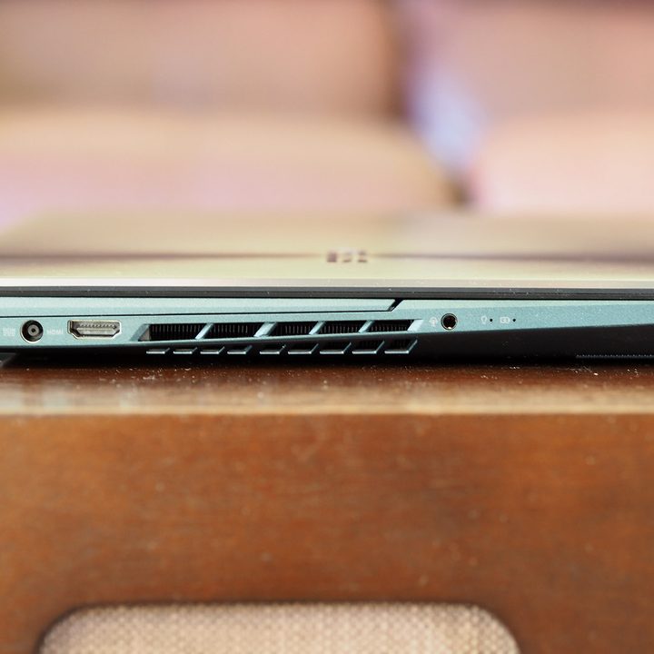 Right side view of closed Asus ZenBook Pro Duo 15 showing plug in ports.