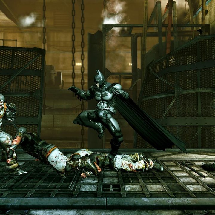 Batman defeating enemies in Batman: Arkham Origins Blackgate.