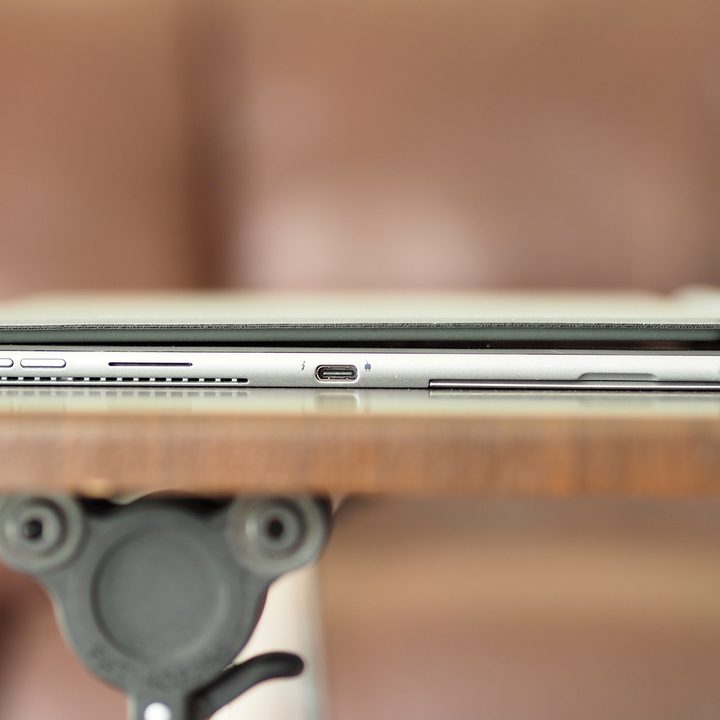 A profile image of the Dell Latitude 7320 Detachable showing its charging port and power buttons.