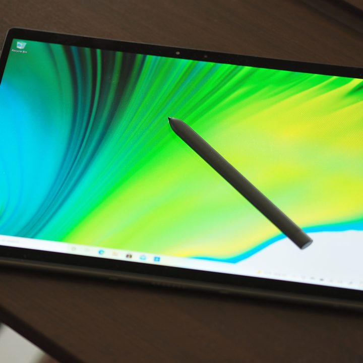 Dell Latitude 7320 Detachable being used as tablet with stylus.
