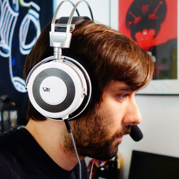 A man wearing the VZR Model One headphones.