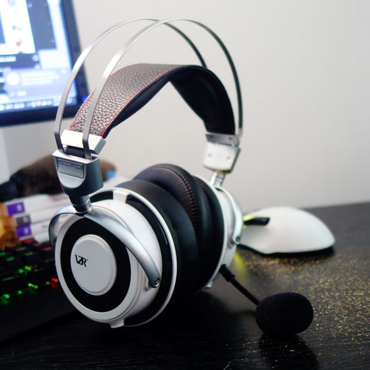 The VZR Model One headphones sitting on a desk.