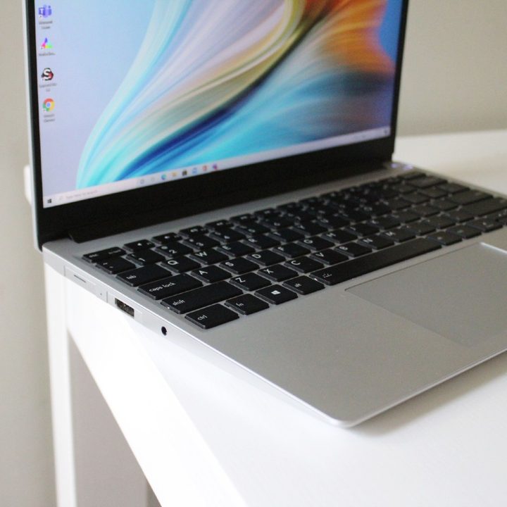 The Framework Laptop, open on a white table.