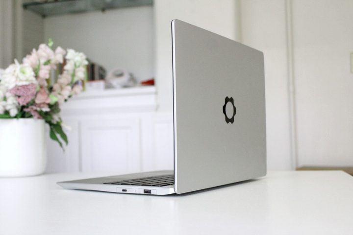 The Framework Laptop on a white table.