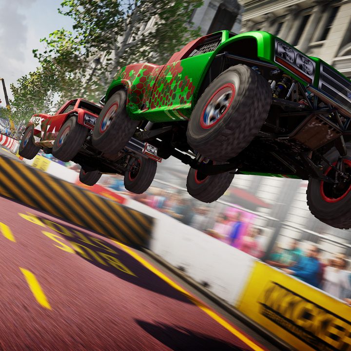 Two cars launch off a jump in Grid Legends.