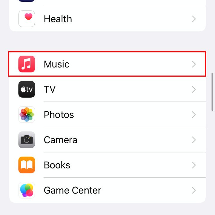 iOS 15's Settings menu. Music is highlighted in red.