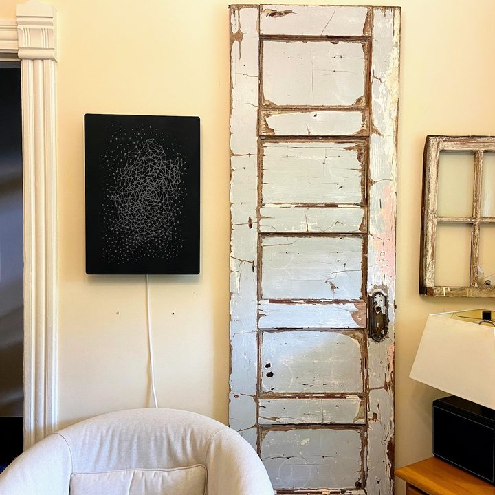 Ikea Symfonisk Picture Frame Speaker hung vertically on a wall.