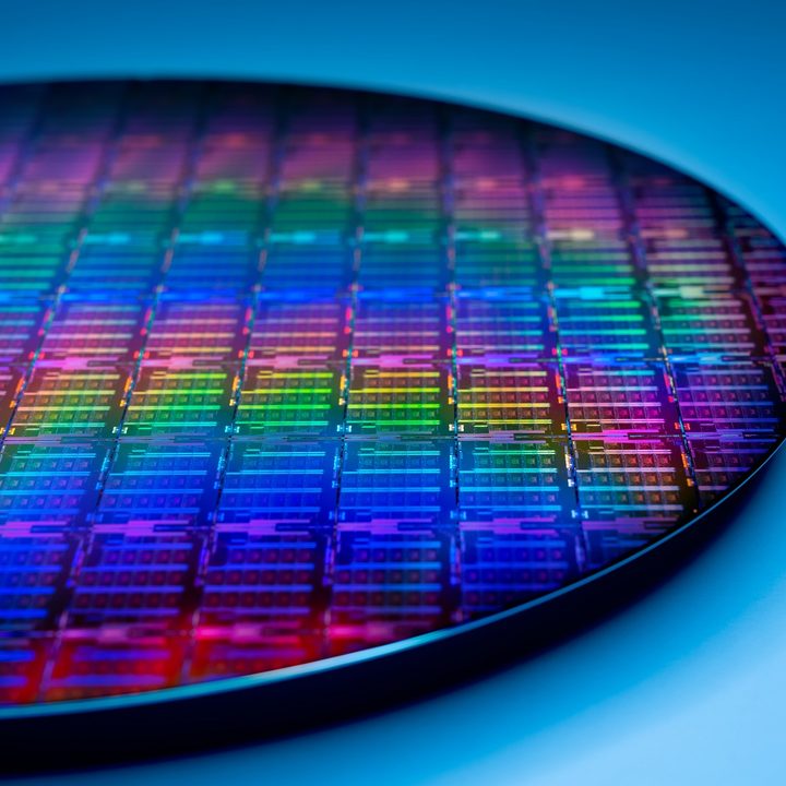 An Intel wafer on a blue background.