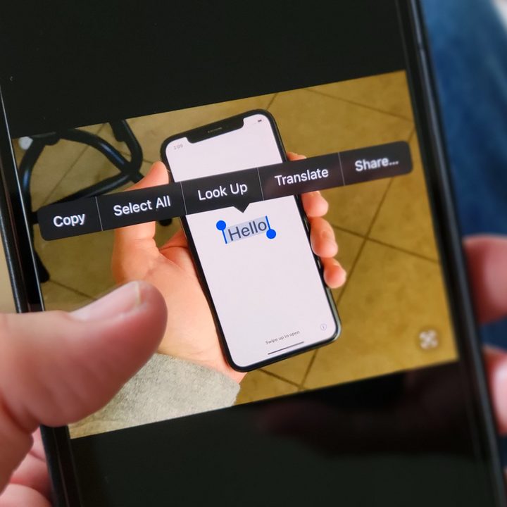 Live Text in use, showing copy-paste elements over an image containing the word "hello" on a phone screen.