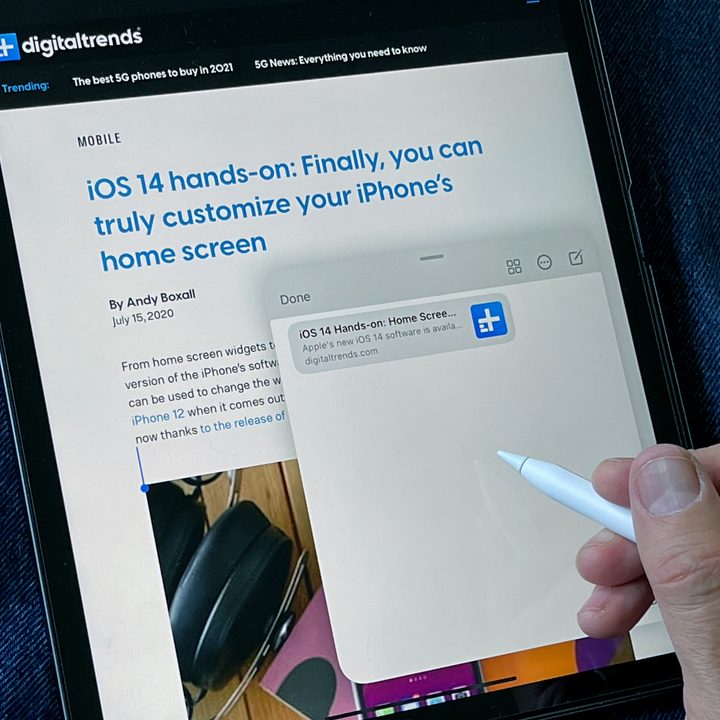 An Apple Pencil points at the multitasking menu on an iPad screen.
