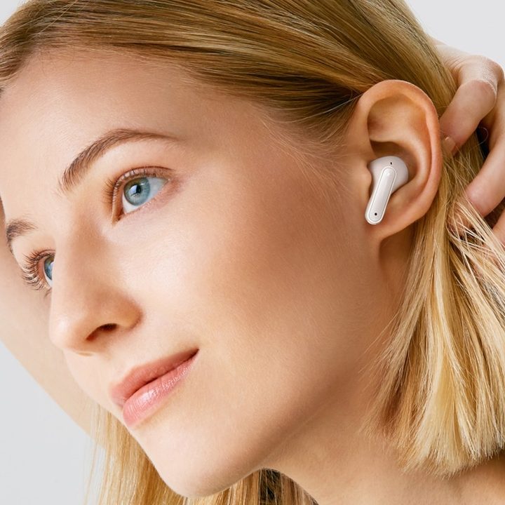 Woman wearing :G Tone Free FP8 True Wireless Earbuds.