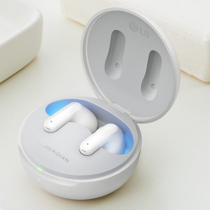 LG Tone Free FP8 True Wireless Earbuds on a white surface.
