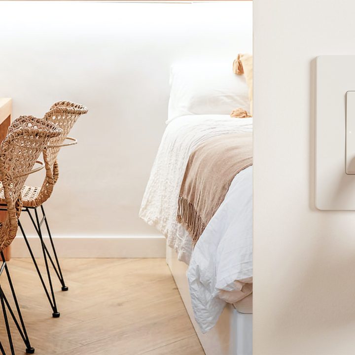 Finger pressing on Nokia Smart Lighting switch.