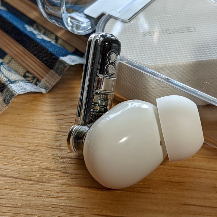 A Nothing Ear 1 earbud seen from the side.