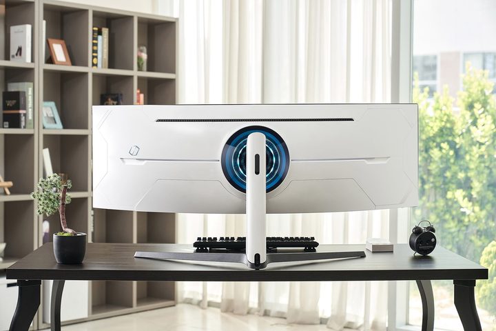 Back view of Samsung's new QLED Odyssey gaming monitor sitting on desk.
