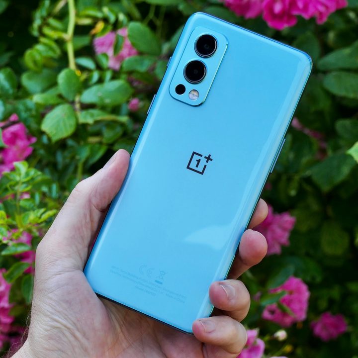 OnePlus Nord 2 from the back, held in hand.