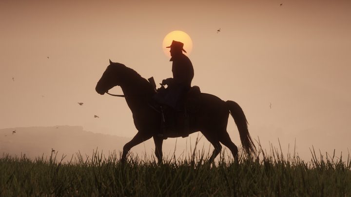 A cowboy riding a horse in Red Dead Redemption 2.