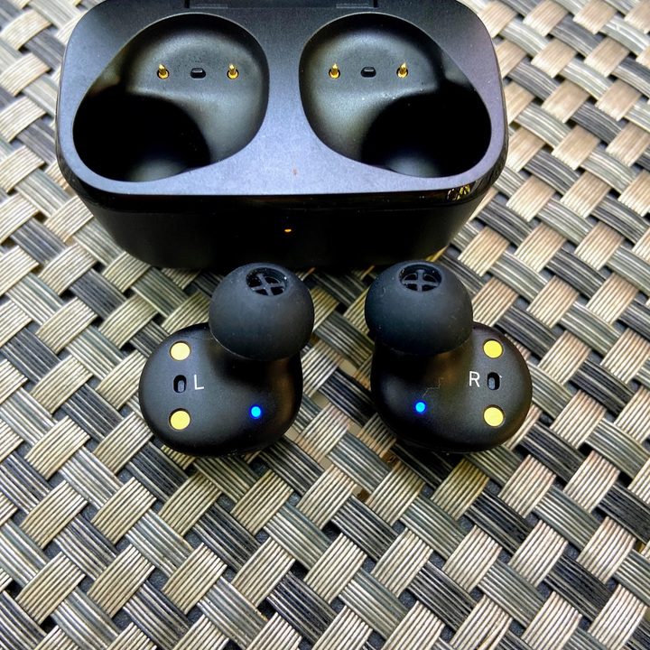 Sennheiser CX True Wireless earbuds beside charging case.